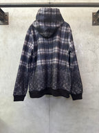 Navy plaid hoodie with attached hood and dark ribbed cuffs