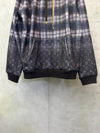 Long-sleeve hoodie in navy plaid with dark logo print and ribbed hem