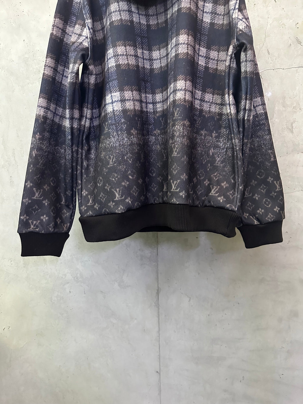 Navy plaid hoodie with dark ribbed cuffs and allover monogram print