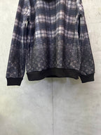 Navy plaid hoodie with dark ribbed cuffs and allover monogram print