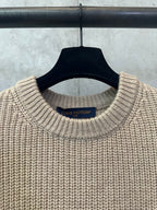 Beige knit sweater neckline with Louis Vuitton brand label