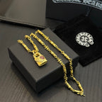Gold-tone chain necklace with rectangular pink gemstone charm, shown with matching chain
