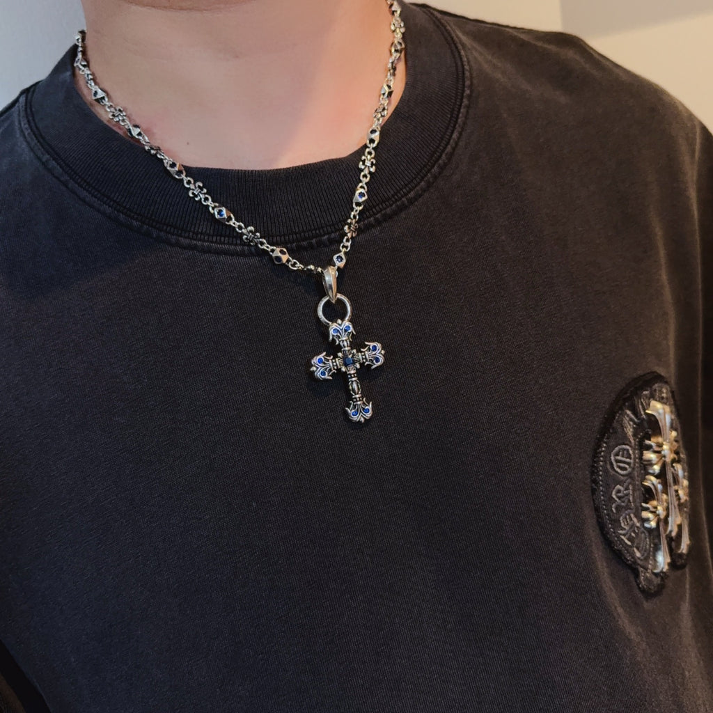 Cross pendant necklace with silver-tone chain and blue enamel cross pendant
