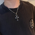 Cross pendant necklace with silver-tone chain and blue enamel cross pendant