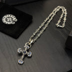 Cross pendant necklace with blue enamel, silver-tone chain and clasp detail
