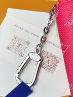 Louis Vuitton small women's bag with pink textured leather and silver chain strap