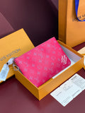 Pink Louis Vuitton mini pouch with repeating monogram, zip closure and chain strap