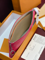 Louis Vuitton pink monogram wristlet pouch with tan lining and silver zipper