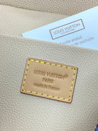 Louis Vuitton interior leather label patch in light beige