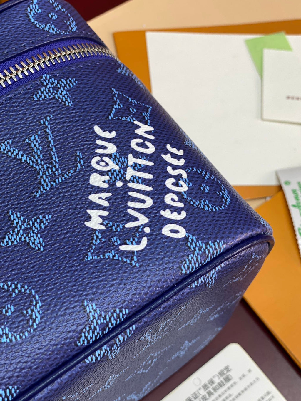 Louis Vuitton blue monogram fabric with 'Made in France' printed text