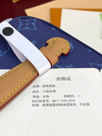 Louis Vuitton blue monogram bag with tan strap and authenticity card