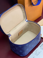 Louis Vuitton blue monogram vanity bag open to light-beige lined interior