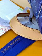 Louis Vuitton blue monogram bag handle, tan trim with attached strap