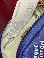 Monogram bag interior with cream lining and gold-tone zipper; close-up of stitching.