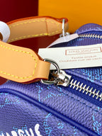 Louis Vuitton blue monogram bag detail, silver zipper pull and ring hardware