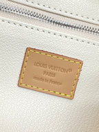 Beige leather interior label reading “LOUIS VUITTON PARIS” with made in France.