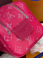 Pink monogram canvas bag with Louis Vuitton logo patch and zip closure