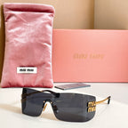 Miu Miu glasses with gold-tone frame and dark gray tinted lenses