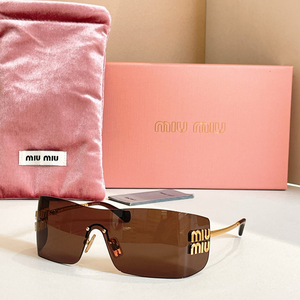Miu Miu glasses with gold-tone frame and brown tinted lenses