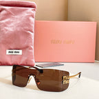 Miu Miu glasses with gold-tone frame and brown tinted lenses