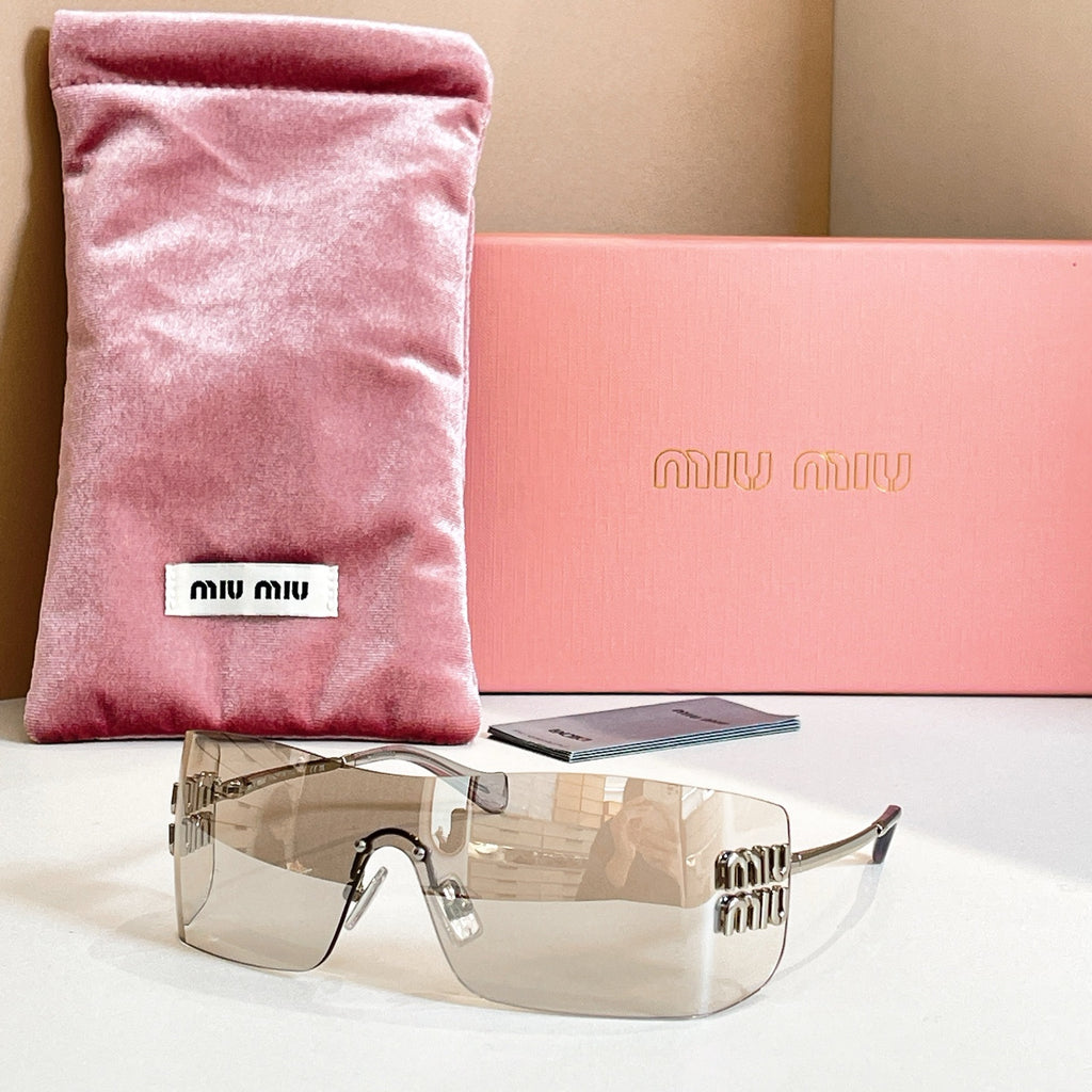 Miu Miu glasses with clear frame and amber tinted lenses