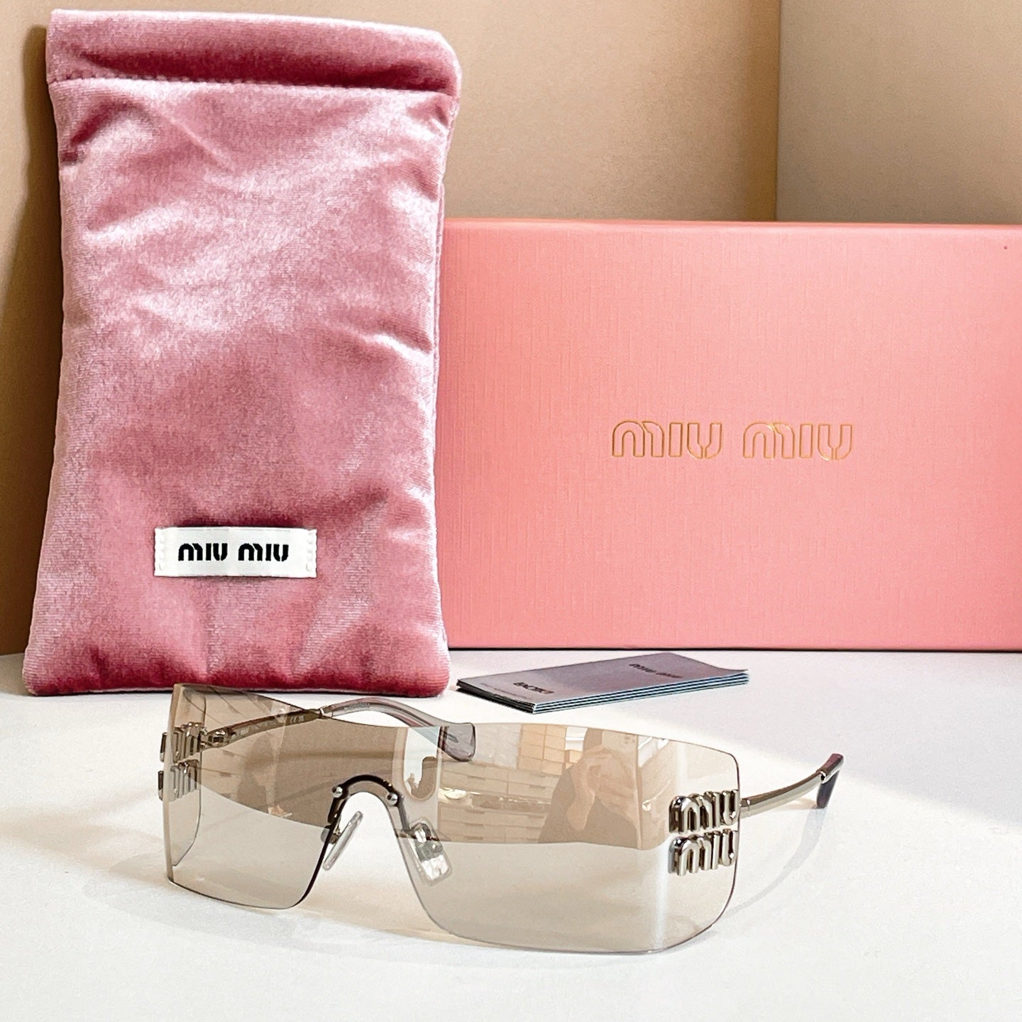 Miu Miu glasses with clear frame and amber tinted lenses