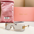 Miu Miu glasses with gold-tone frame and light gray tinted lenses