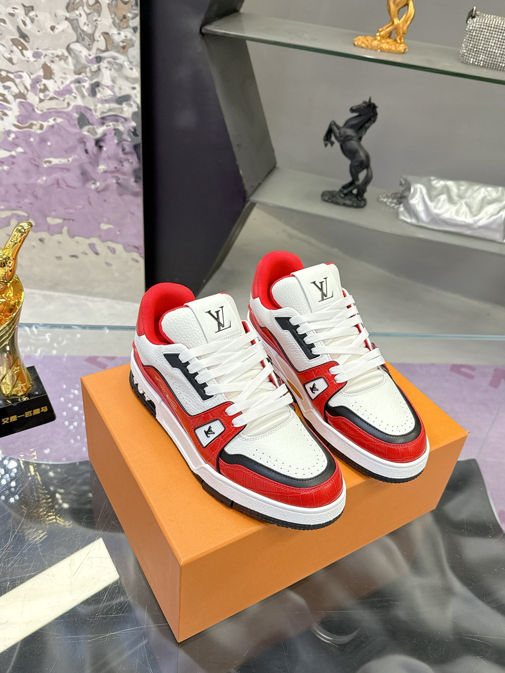 White, red and black Louis Vuitton low-top sneakers with lace-up front and LV logo patch