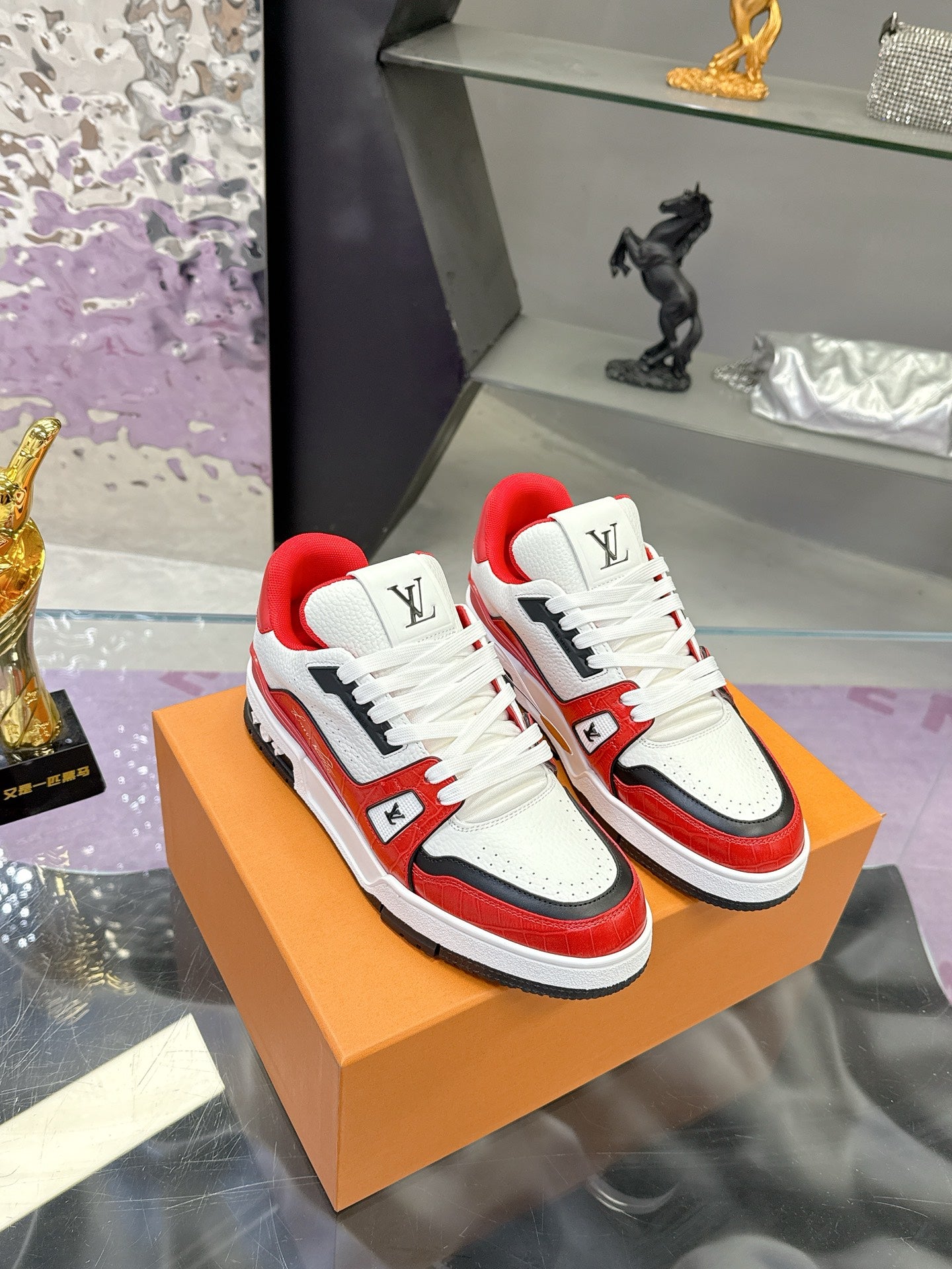 White, red and black Louis Vuitton low-top sneakers with lace-up front and LV logo patch