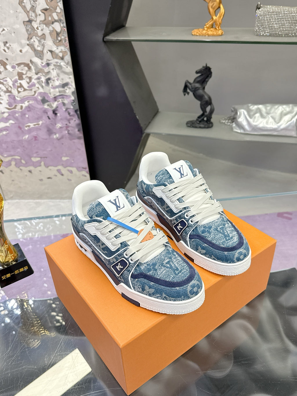 Louis Vuitton ladies sneakers, blue textured upper, white laces, LV logo accents