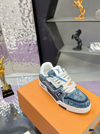 Louis Vuitton ladies sneakers, close side profile with blue textured upper and white laces