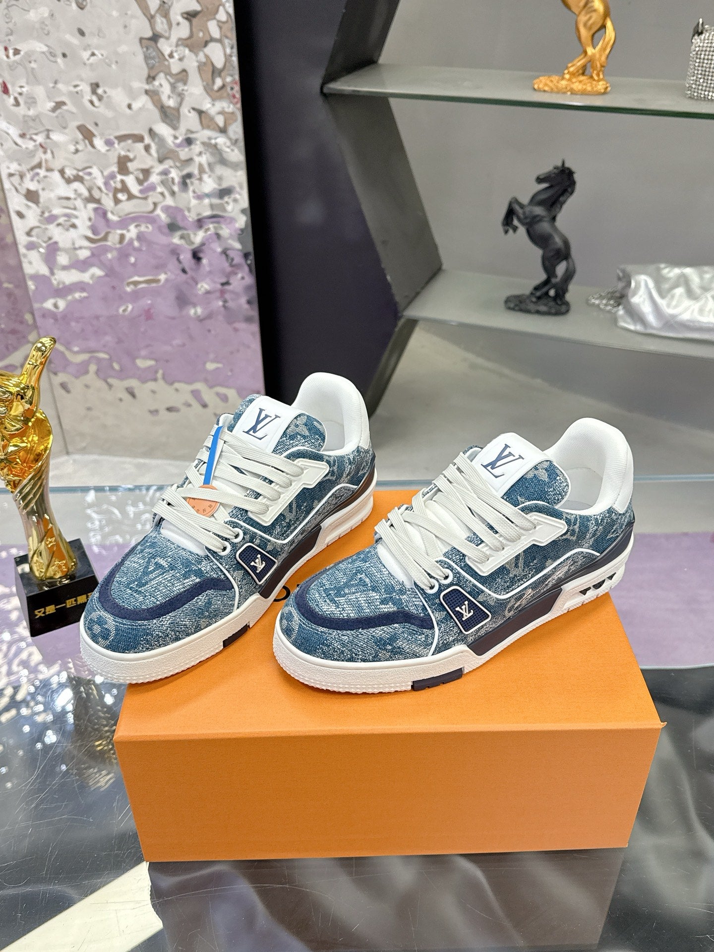 Louis Vuitton ladies sneakers pair, blue and white patterned panels, white laces, low profile