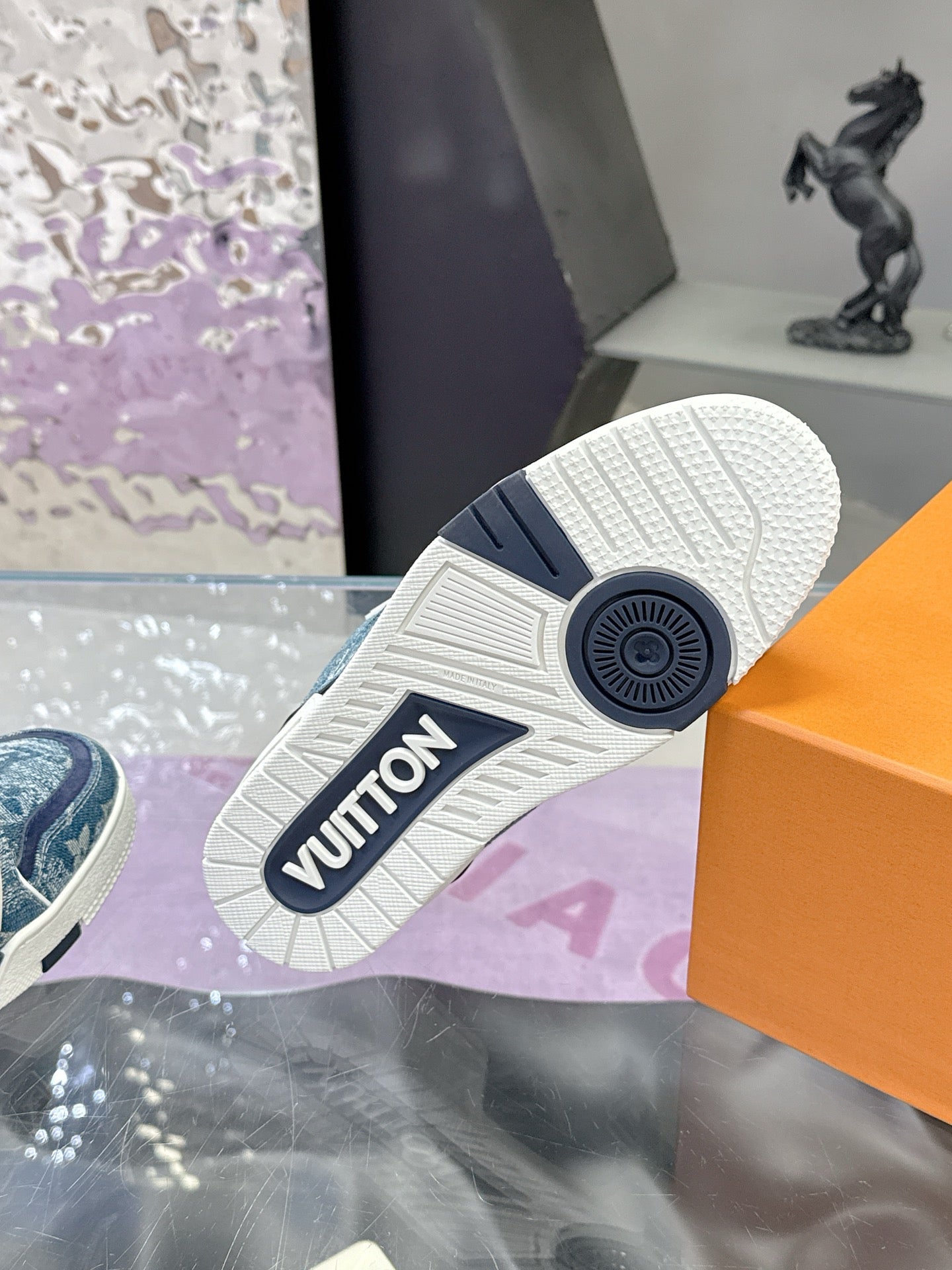Louis Vuitton ladies sneaker outsole, textured tread with 'VUITTON' logo on heel