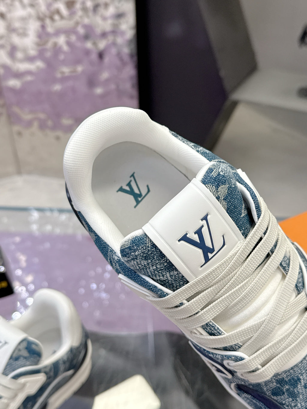 Louis Vuitton ladies sneaker heel and side, white collar with LV logo, blue patterned fabric