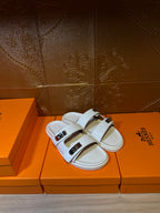 Hermes white slide sandals, two adjustable-look straps with metal buckles