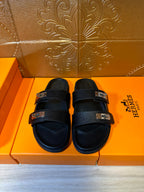 Hermes black leather sandals with two wide buckled straps