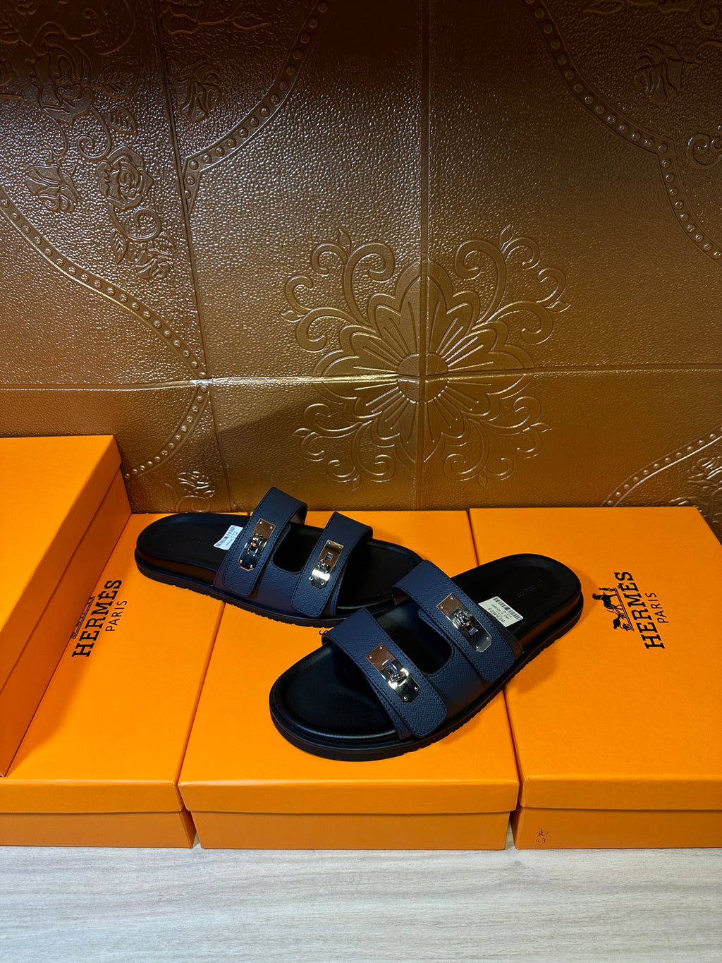 Hermes blue leather slide sandals with black sole and two silver-tone buckles