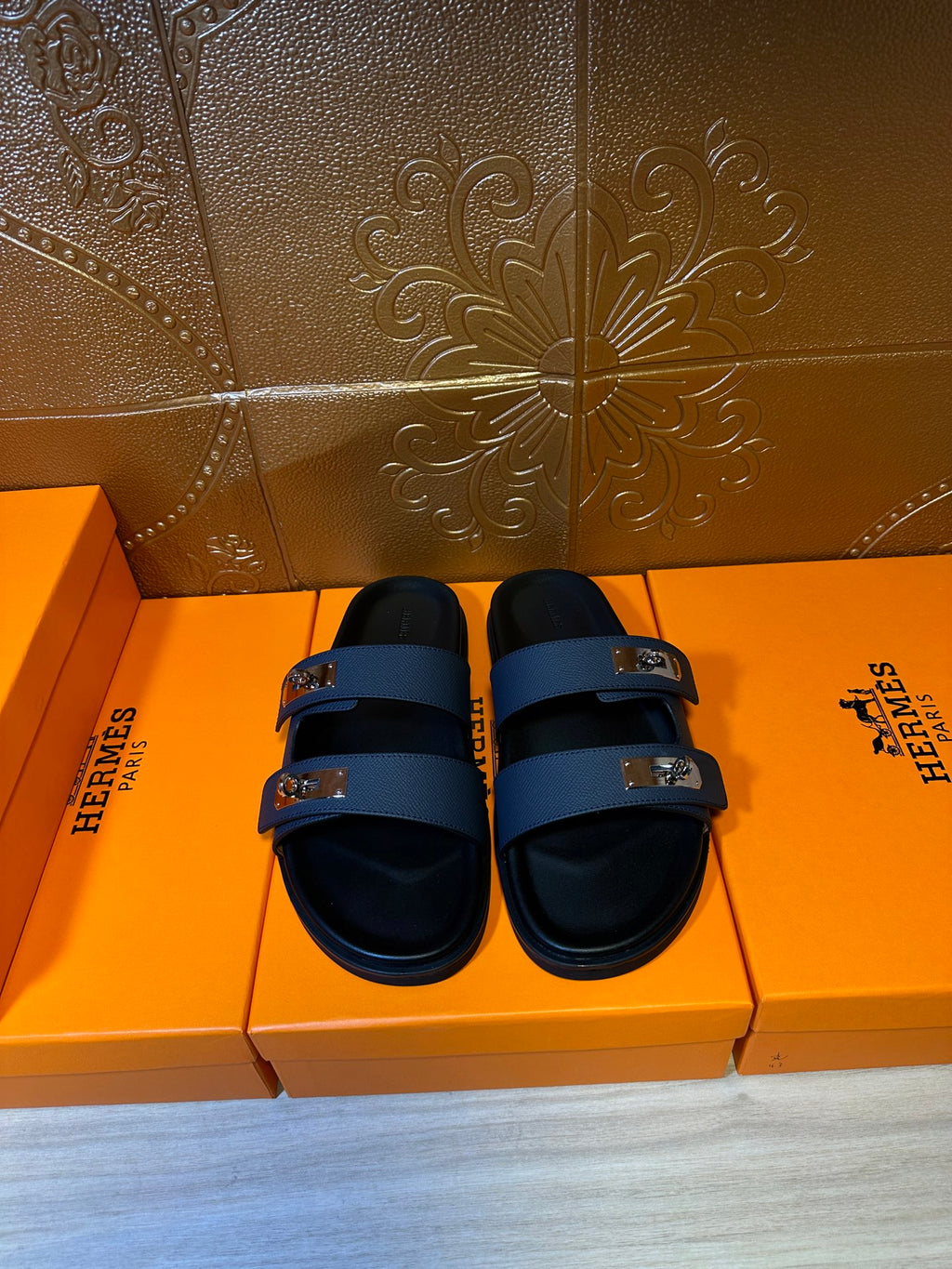 Hermes blue leather slide sandals with two silver-tone buckles