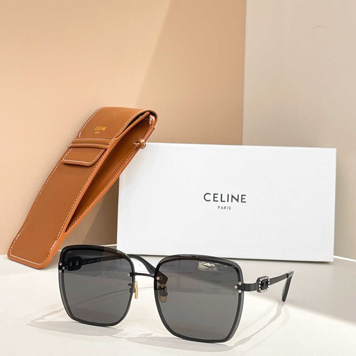 Celine glasses with black square frames and dark tinted lenses, silver-tone arms