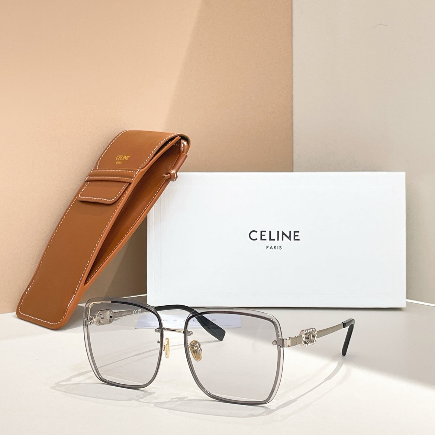 Celine glasses with clear gray frames and tinted lenses, gold-tone hardware