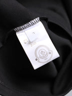Moncler black T-shirt with interior size label and care tag at collar
