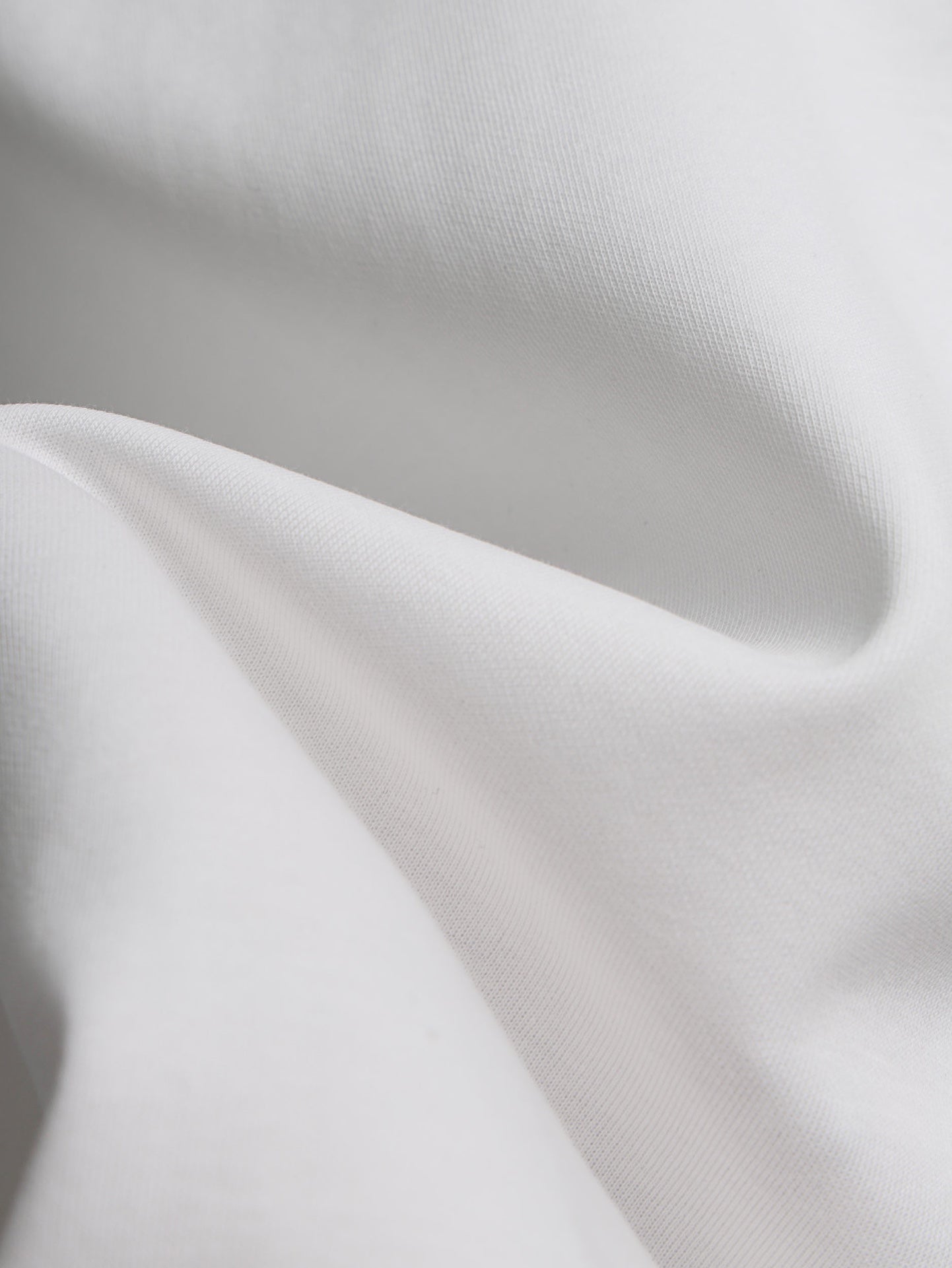 Close-up of white T-shirt fabric texture