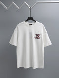 White T-shirt with short sleeves and burgundy logo embroidery on the chest
