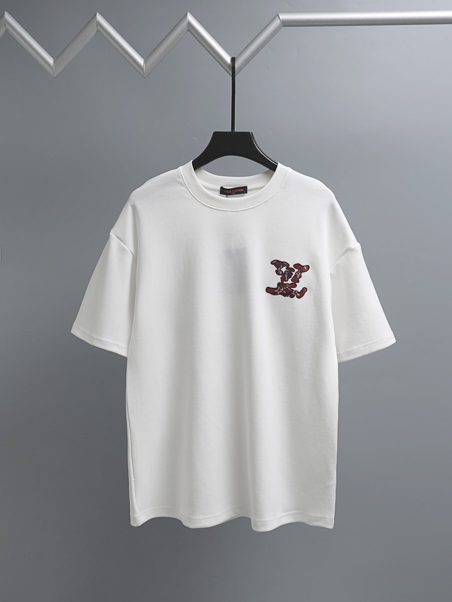 White T-shirt with short sleeves and burgundy logo embroidery on the chest