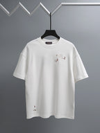 White crewneck T-shirt with embroidered multicolor bird graphics on the chest