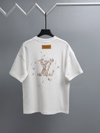 White T-shirt with graphic dot pattern on back and small logo label