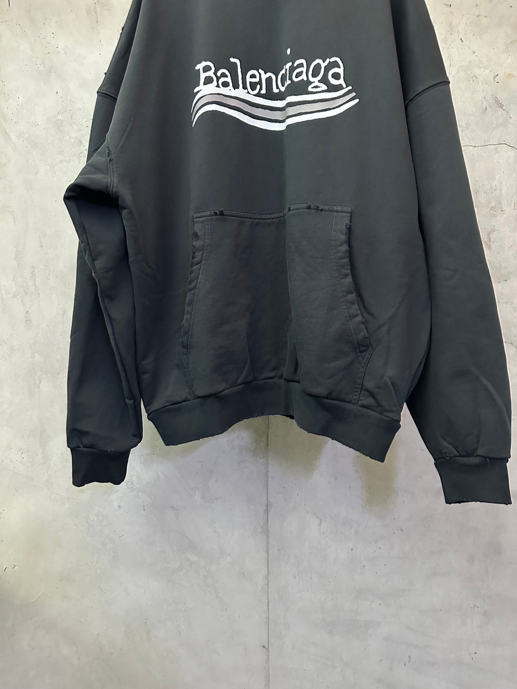 Black Balenciaga hoodie with chest logo and kangaroo pocket