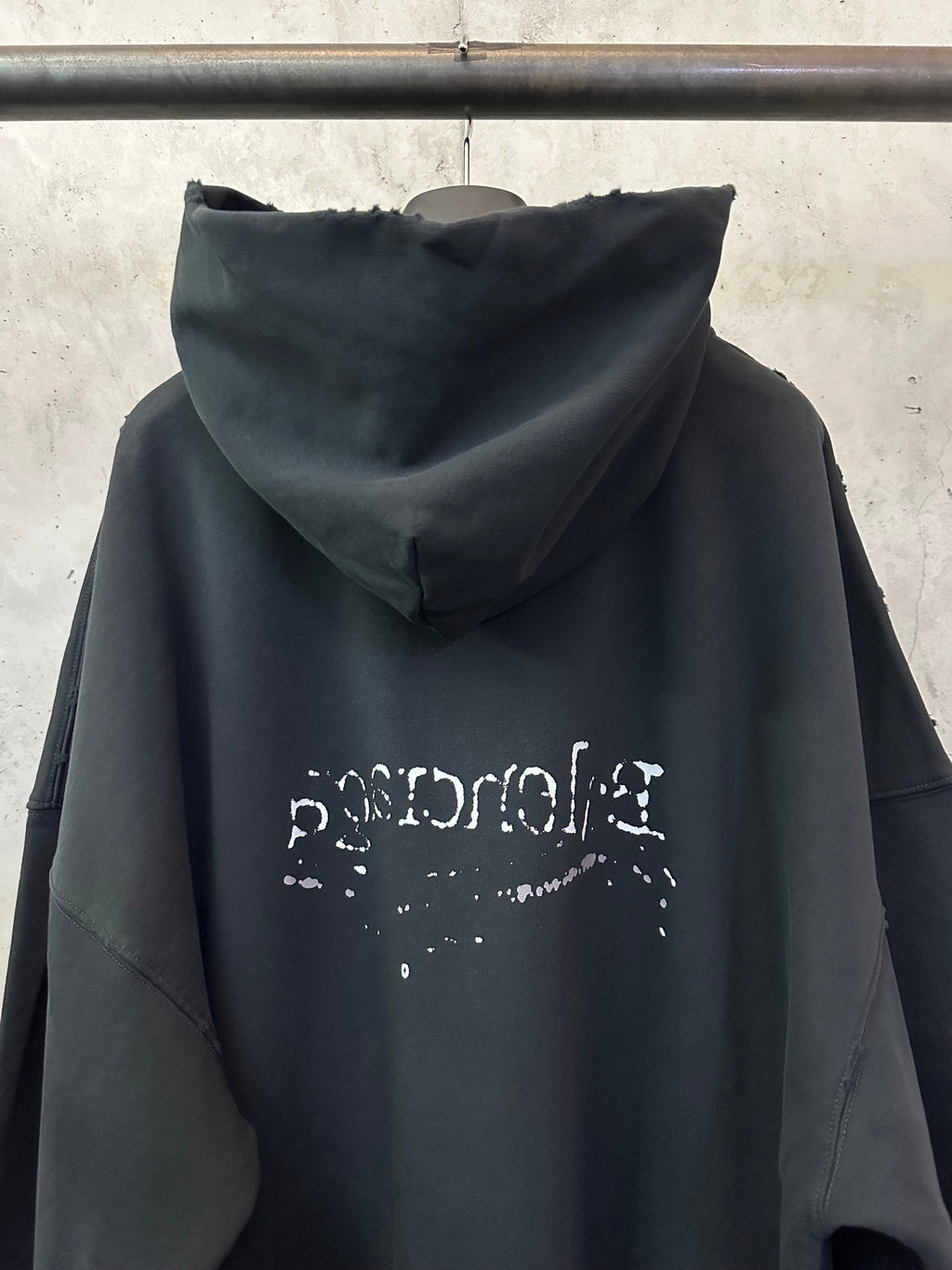 Black Balenciaga hoodie back hood with faded logo graphic