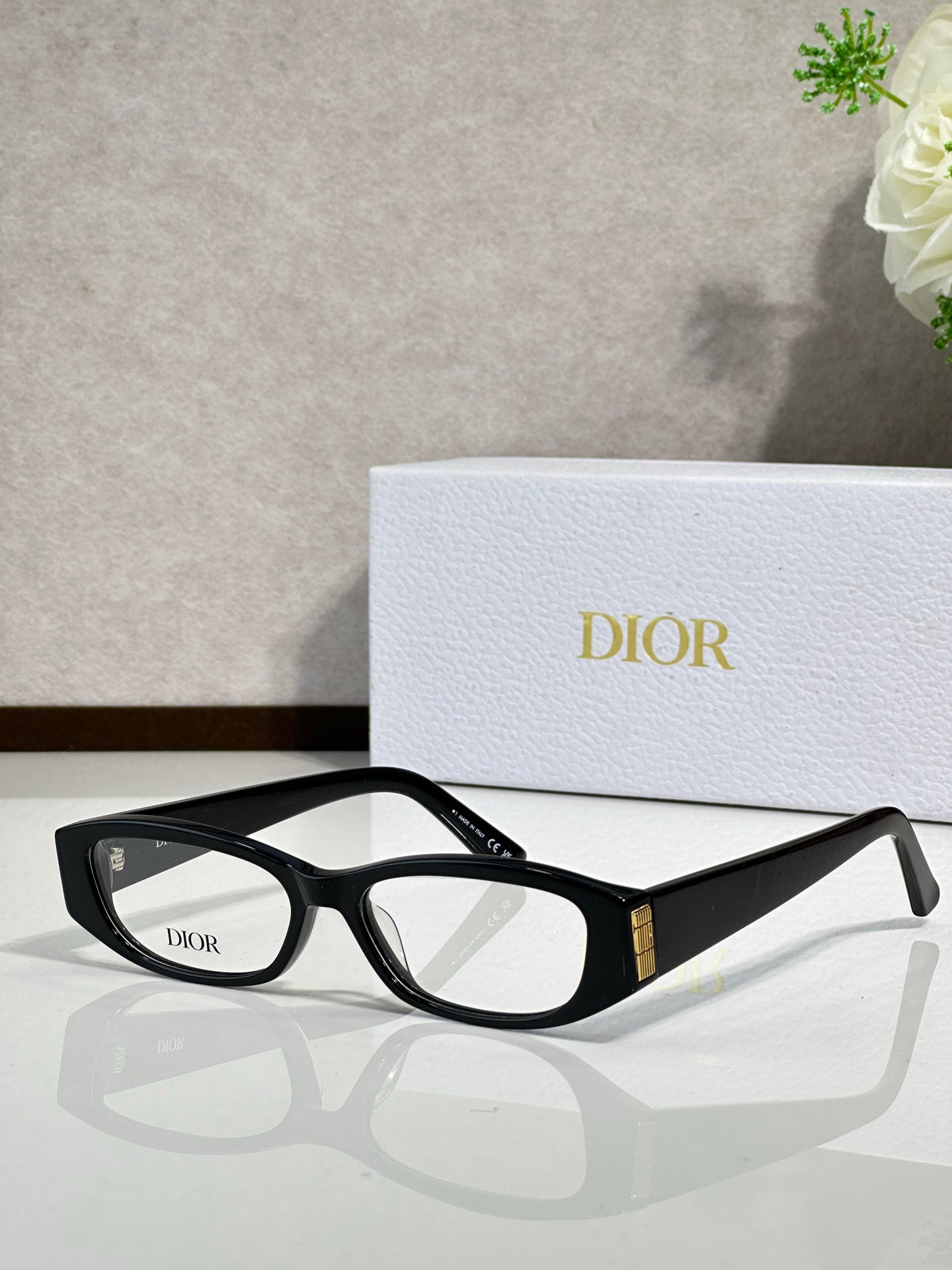 Black eyeglasses with clear lenses, Dior logo on temple, gold accent