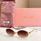 MiuMiu oval sunglasses with gold-tone frame and warm brown gradient lenses
